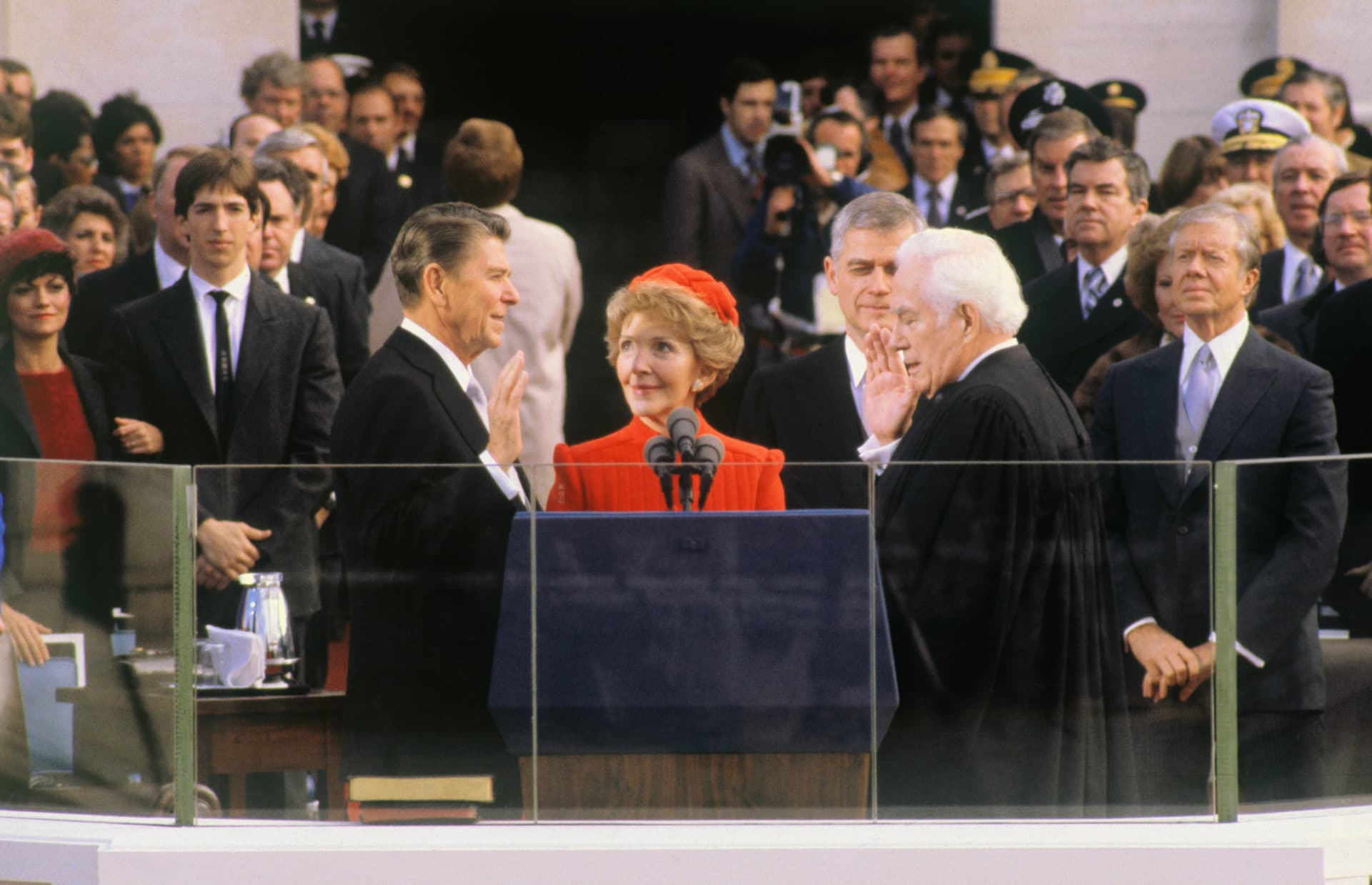Ronald Reagan takes the presidential oath of office. After speculation that he may miss the ceremony due to the Iranian hostage situation, President Jimmy Carter (right) was there. (Getty Images)