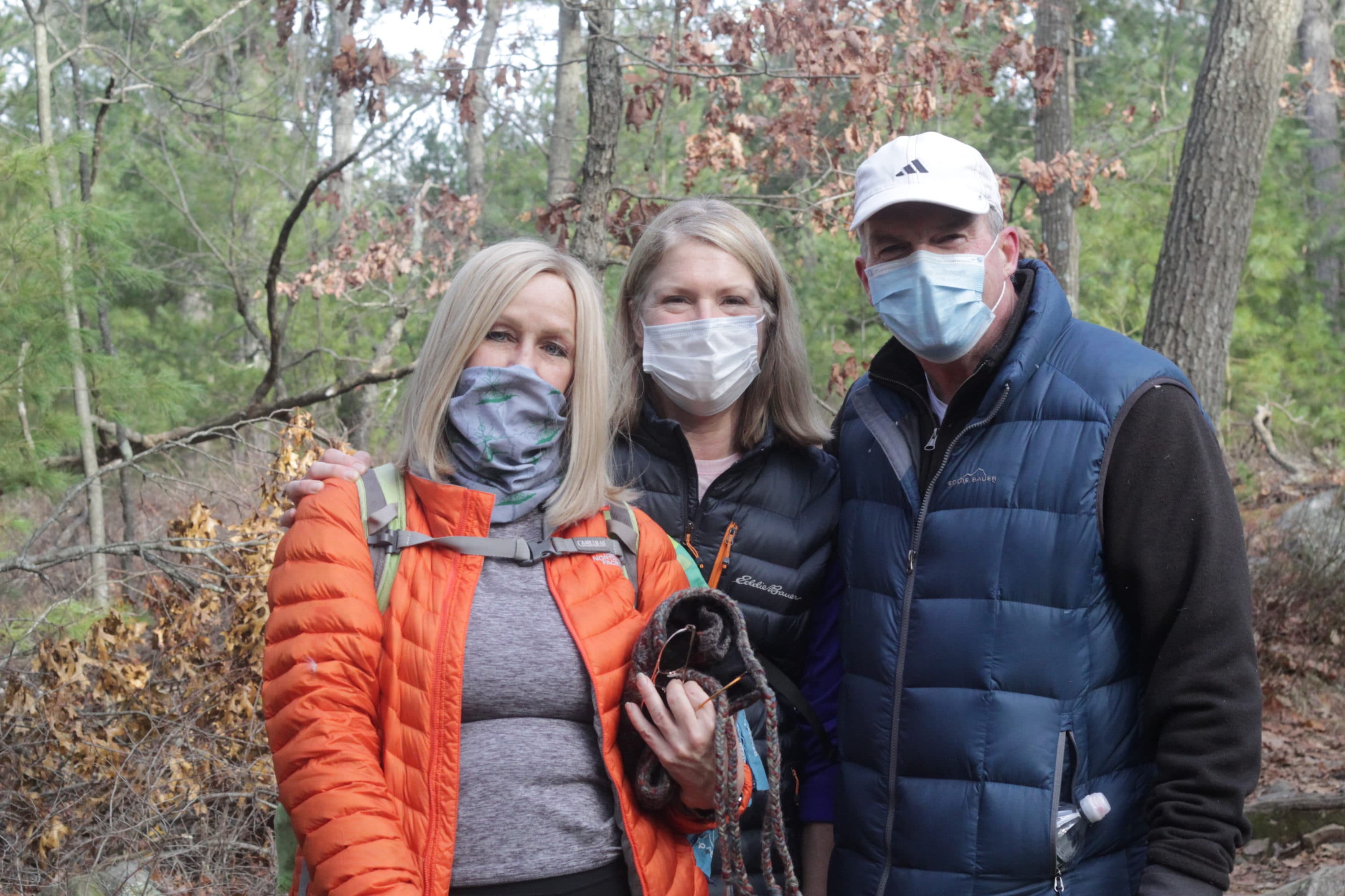 Denise Monroe (Left), Lisa Van Dore (Center) and Mike Abbott (Right) went hiking in Blue Hills Reservation on to start off 2021. (Quincy Walters/WBUR)