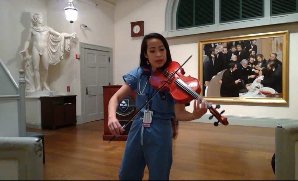 Kathy May Tran studying violin with Luther Warren. (Courtesy)