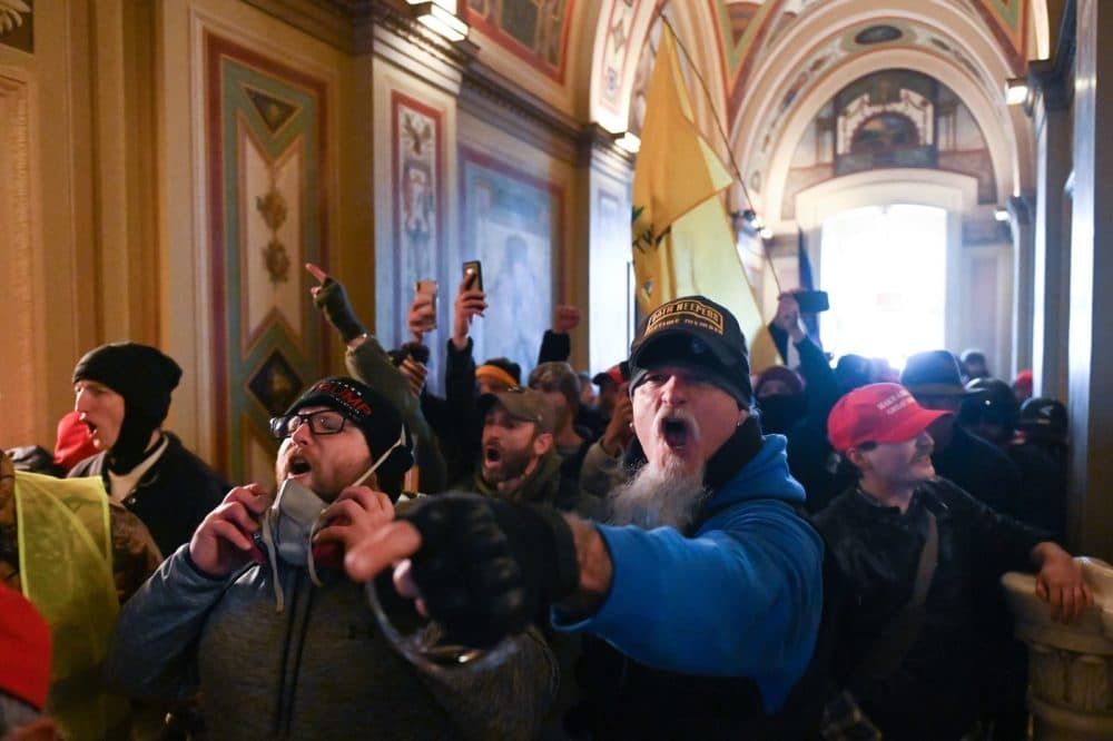 Demonstrators breached security and entered the Capitol on Wednesday as Congress debated the 2020 electoral vote tally. (Roberto Schmidt/AFP via Getty Images)
