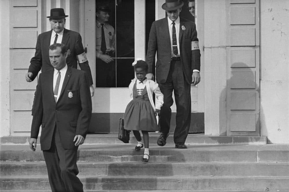 U.S. Deputy Marshals escort 6-year-old Ruby Bridges from William Frantz Elementary School in New Orleans in November of 1960. The first-grader was the only Black child enrolled in the school, where parents of white students boycotted the court-ordered integration law and took their children out of school. (AP)