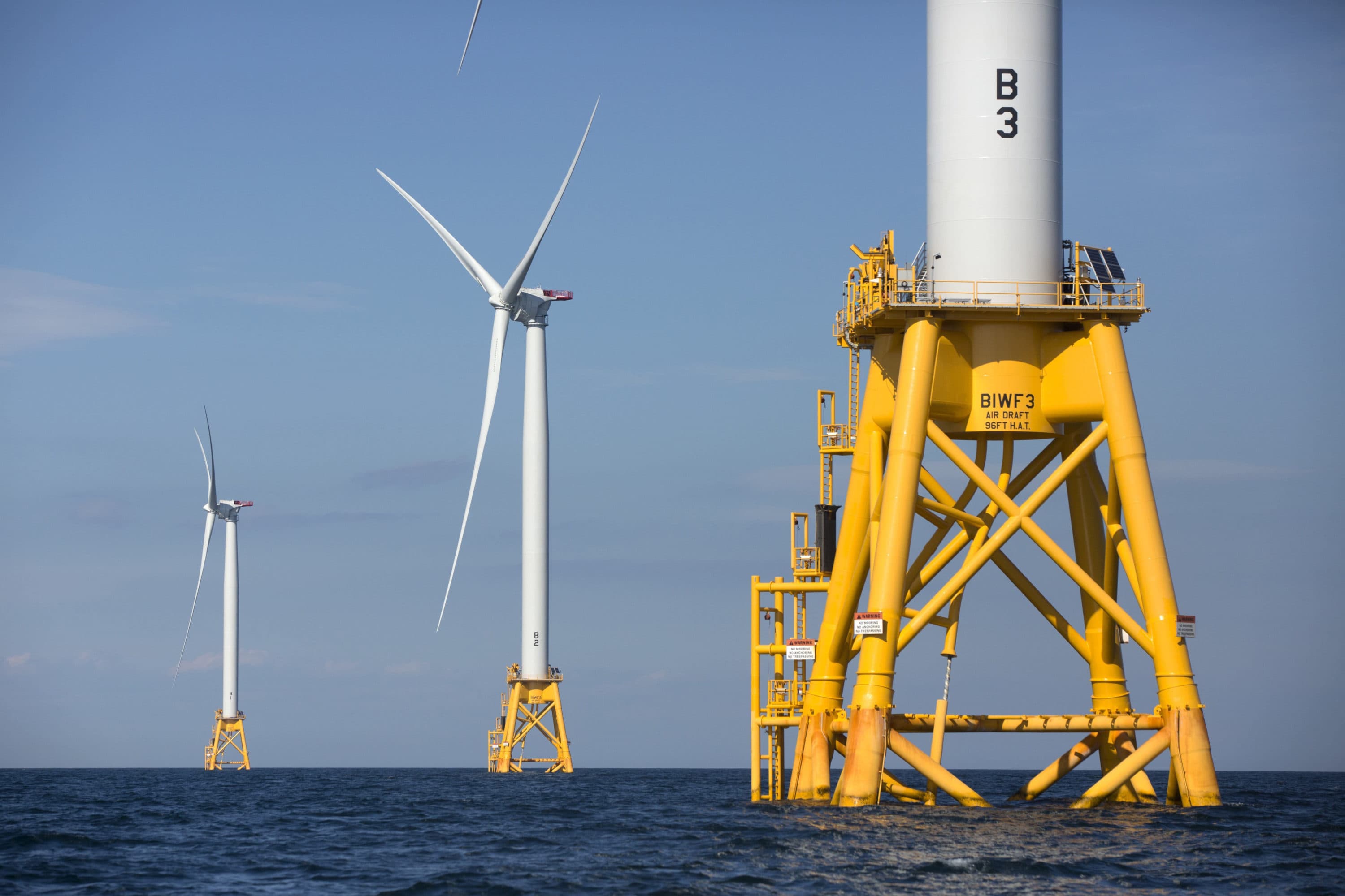 In this 2016 file photo, three of Deepwater Wind's five turbines stand in the water off Block Island, R.I, the nation's first offshore wind farm. (Michael Dwyer/AP)