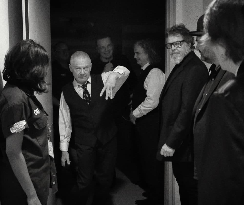 Robert Fripp (center) backstage. (Courtesy Tony Levin)