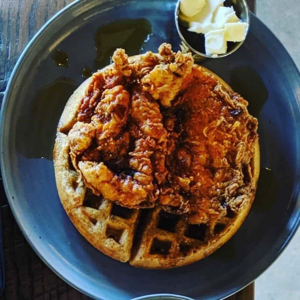 A scallion and sesame waffle with double fried chicken. (Courtesy Brato Brewhouse + Kitchen)