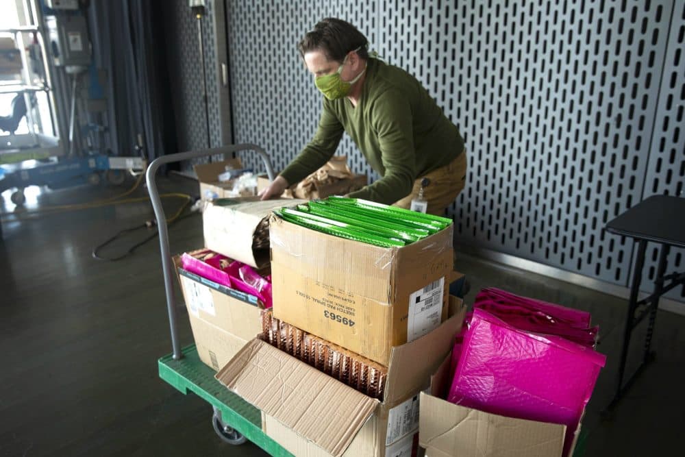ICA facilities manager Will Jeffers organizes boxes of the museum's art kits. (Robin Lubbock/WBUR)