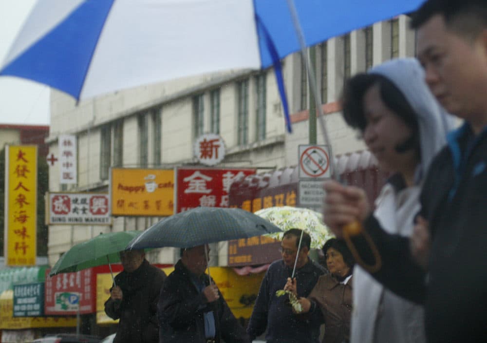 Pedestrians make their way through the Chinatown district in Oakland, California. (Ben Margot/AP)