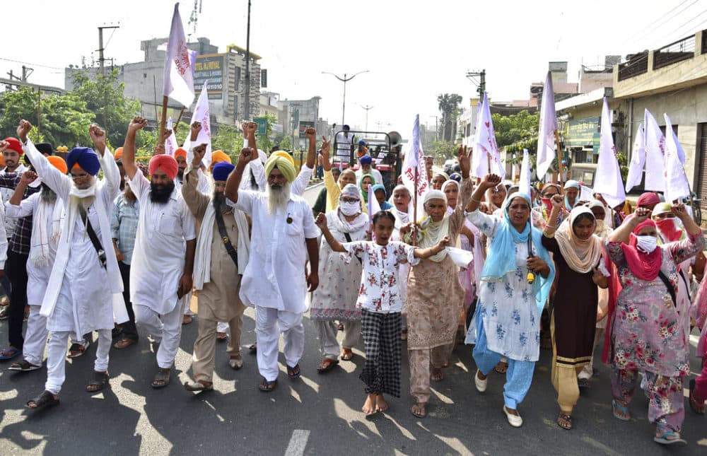 Farmers shout anti-government slogans as they march during a protest in Amritsar, India, Friday, Sept. 25, 2020. (AP Photo/Prabhjot Gill)