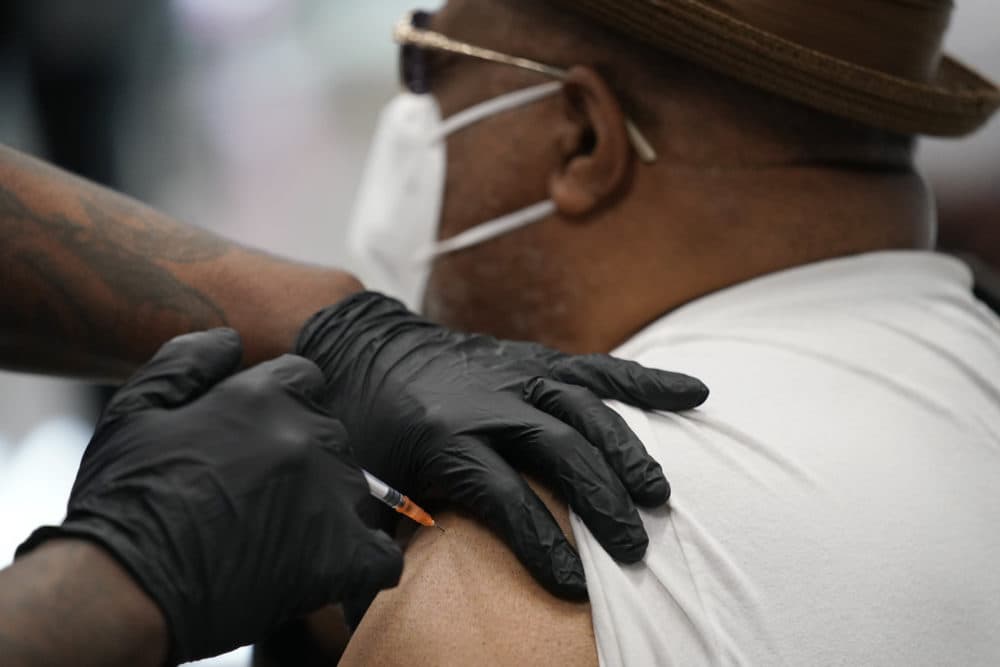 David Williams receives a COVID-19 vaccine on Feb. 10, 2021, in Las Vegas. The makers of COVID-19 vaccines are figuring out how to tweak their recipes against worrisome virus mutations — if and when the shots need an update. (John Locher/AP)