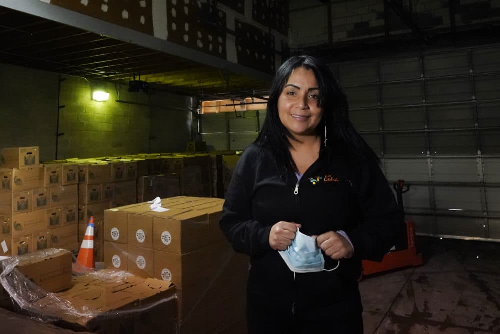 Gladys Vega, executive director of La Colaborativa, poses inside the nonprofit's food pantry warehouse in Chelsea, Feb. 10, 2021. (Elise Amendola/AP)