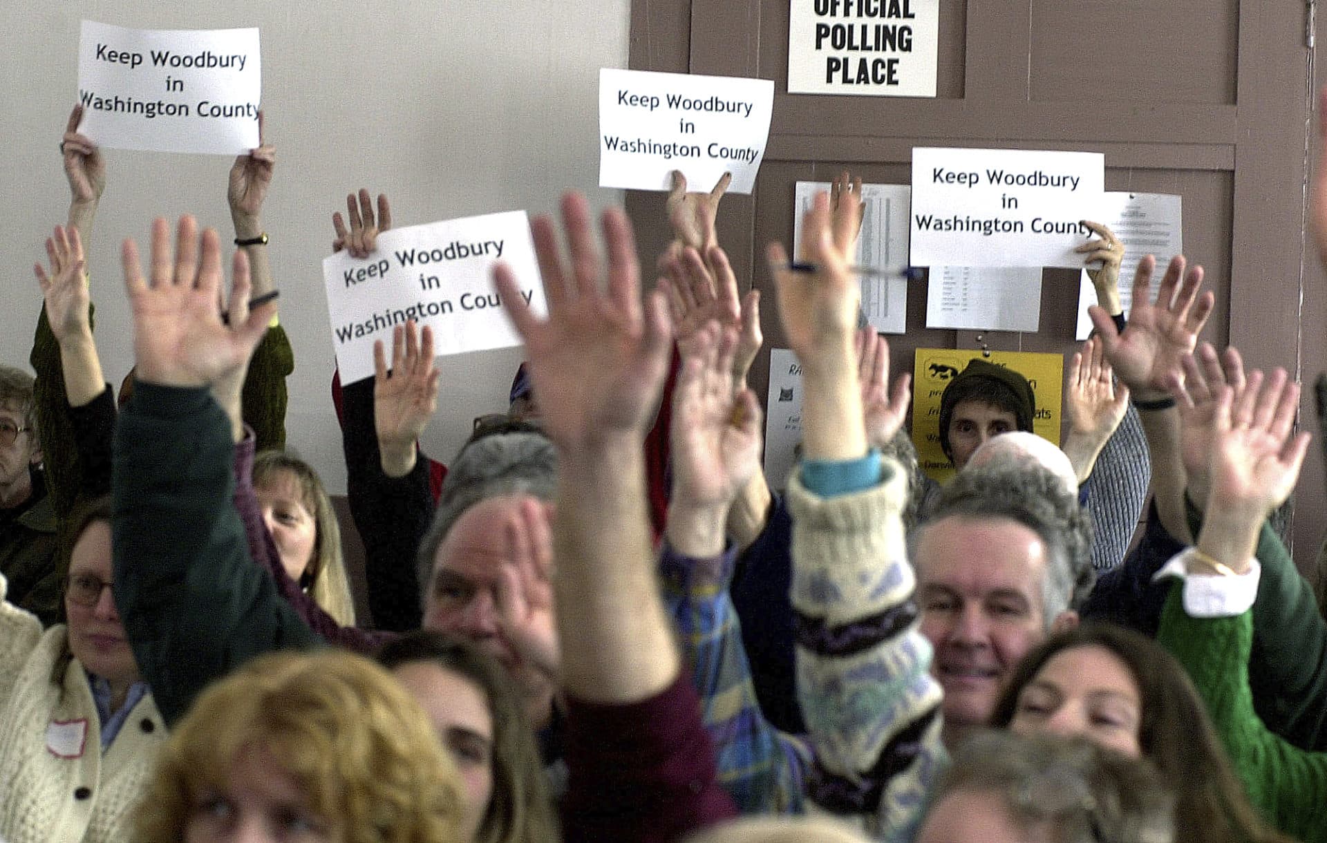 In this March 5, 2002, file photo, citizens vote to support a resolution concerning redistricting during the annual town meeting in Woodbury, Vt. (Toby Talbot/AP File)