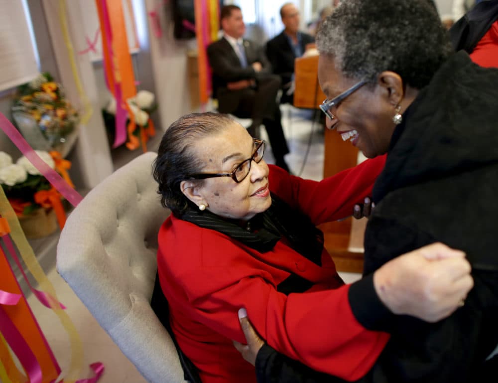 Doris Bunte, left, is congratulated by longtime friend Deborah McBrayer during a ceremony in 2018. Bunte died on Tuesday.(Jonathan Wiggs/The Boston Globe via Getty Images)
