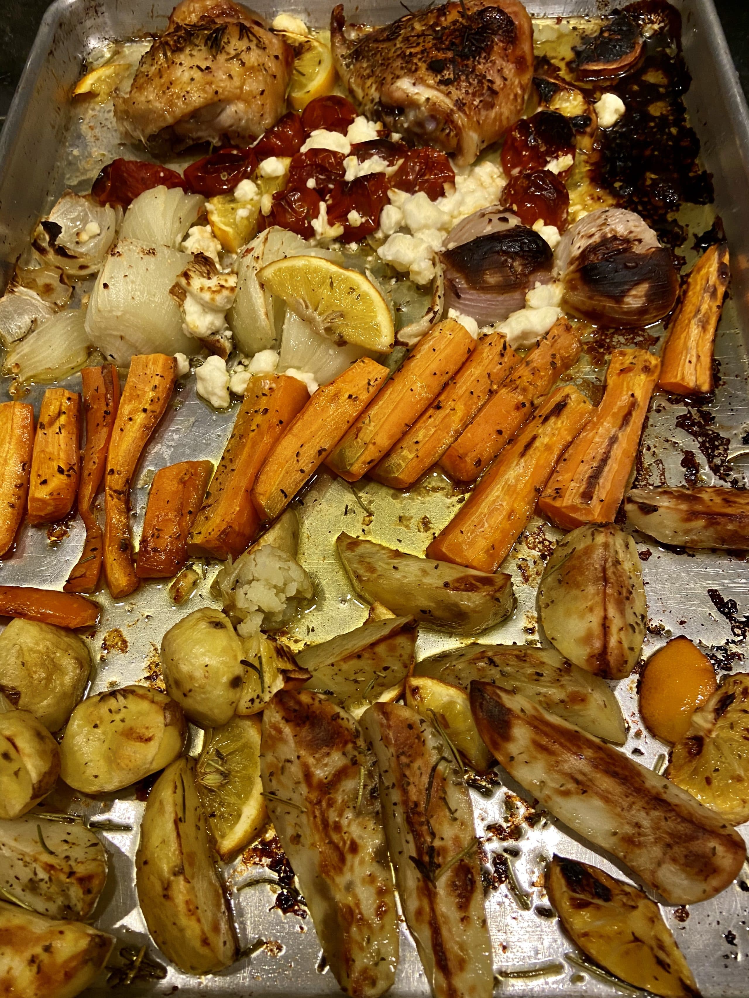 Sheet Pan Greek-Style Chicken, Lemon Potatoes, Carrots, Cherry Tomatoes, And Onions With Feta Cheese. (Kathy Gunst)