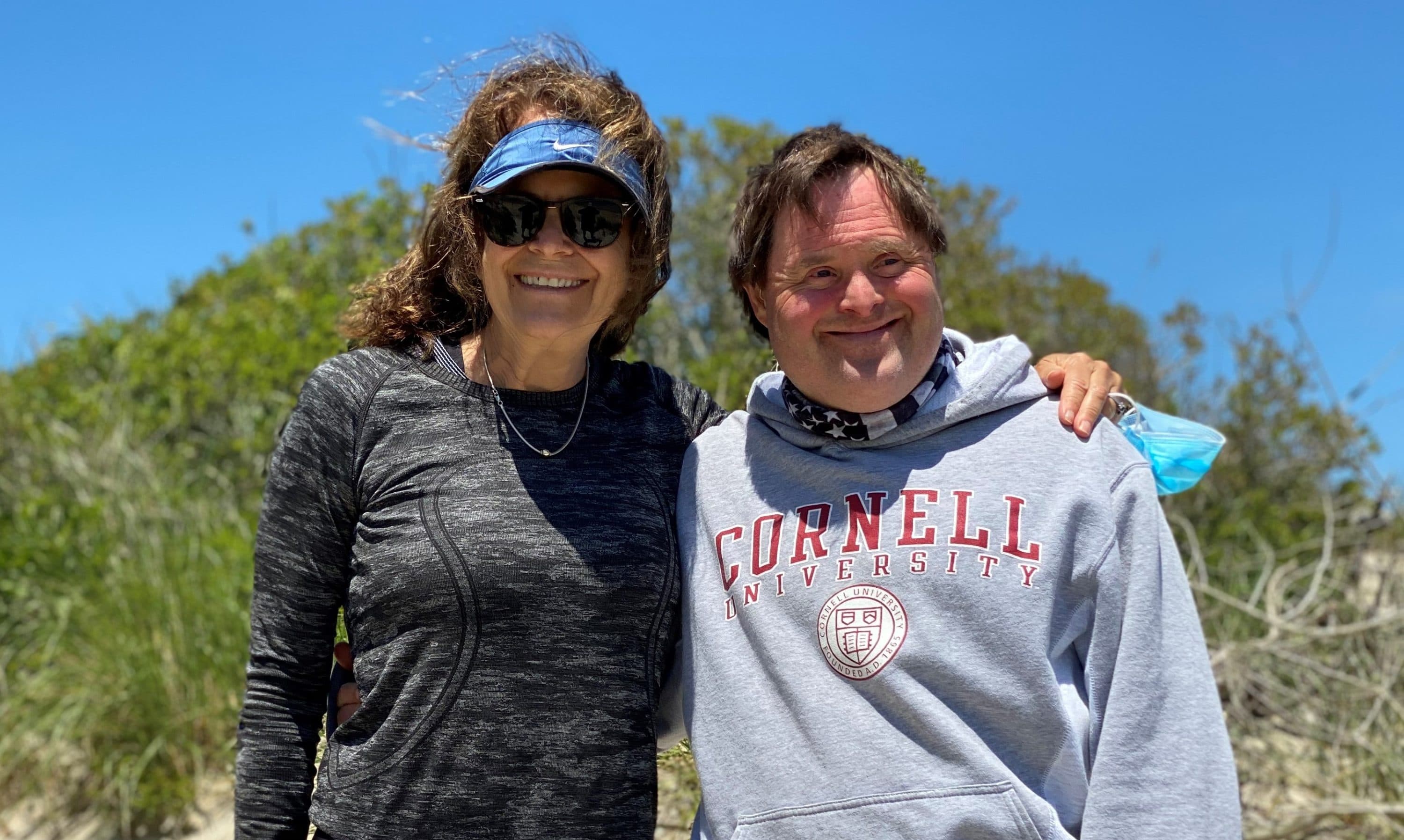 Jonathan Derr, pictured with his mother, Jo Ann Simons, survived COVID-19. Having Down syndrome put Derr at high risk of serious illness. (Courtesy Jo Ann Simons)