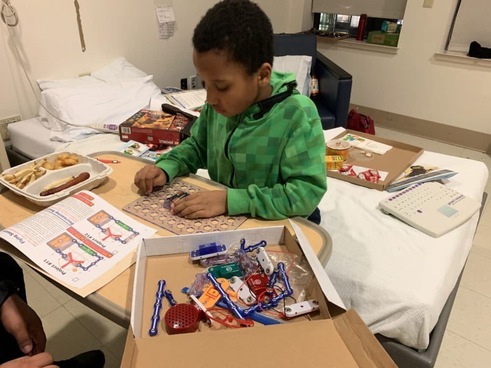 Karin Broadhurst says her son, pictured here in his hospital room, has been boarding for 33 days at Boston Children's Hospital while awaiting an inpatient psychiatric bed anywhere in Massachusetts. (Courtesy)