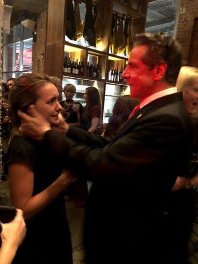 The photo of Cuomo putting his hands on Ruch's face and asking to kiss her. (The New York Times)