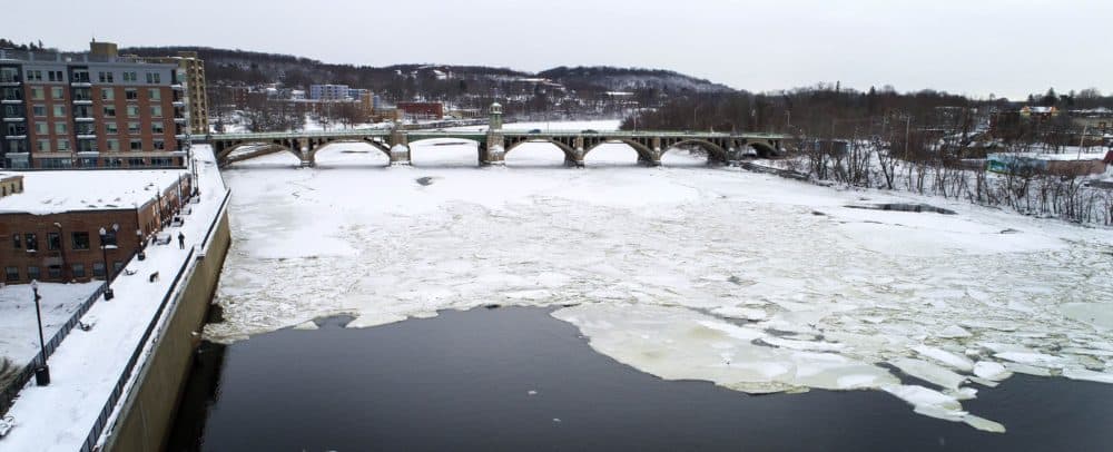 The Merrimack River covered in ice as it passes under Basiliere Bridge in Haverhill. (Robin Lubbock/WBUR)