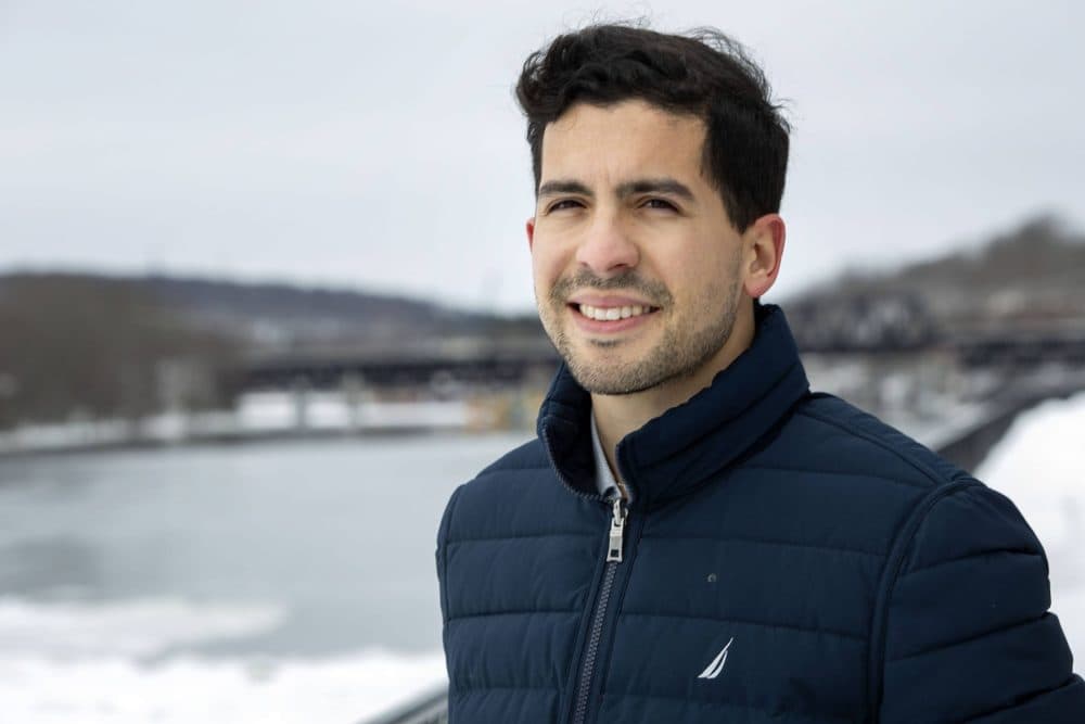 State Representative Andy Vargas next to the Merrimack River in Haverhill. (Robin Lubbock/WBUR)