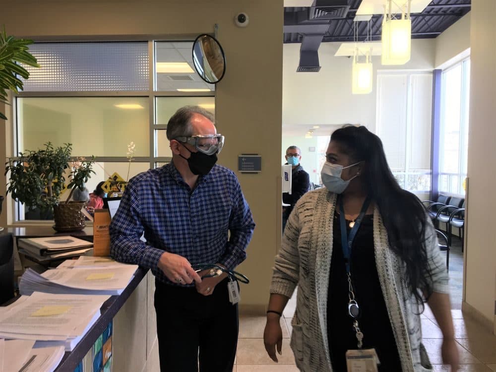 Dr. Andrew Saal and Dr. Nadine Hewamudalige, at a vaccine clinic at the Providence Community Health Centers in February. (Sofia Rudin/RIPR)