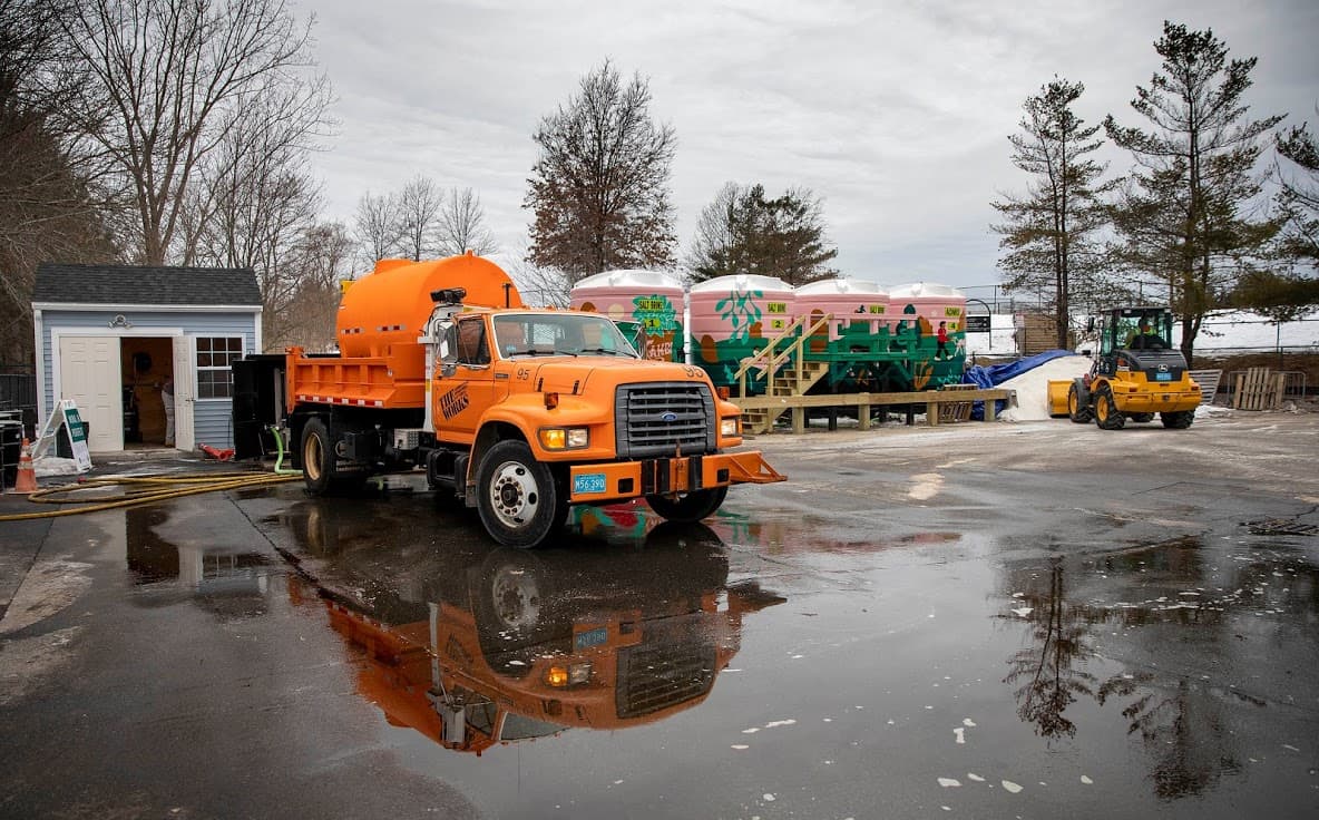 With a snow storm coming a Cambridge Works truck fills up with brine from the tanks at the brine mixing station at Danehy Park. (Robin Lubbock/WBUR)