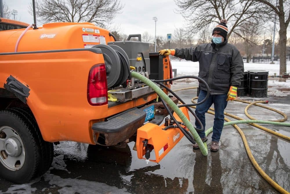 TJ Shea, Superintendent of Streets at the Cambridge Dept. of Public Works, watches as brine fills the tank of a truck about to spray Cambridge's main streets, ahead the arrival of a snow storm. (Robin Lubbock/WBUR)