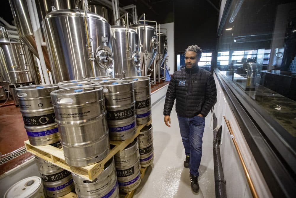 Ray Berry walks through White Lion Brewing's new facility which opened last year. (Jesse Costa/WBUR)