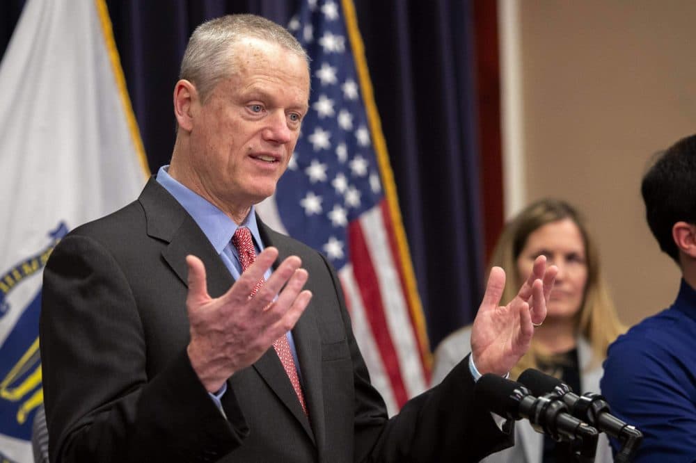 Gov. Charlie Baker talks with reporters at a press conference in the State House in March 2020. (Robin Lubbock/WBUR)