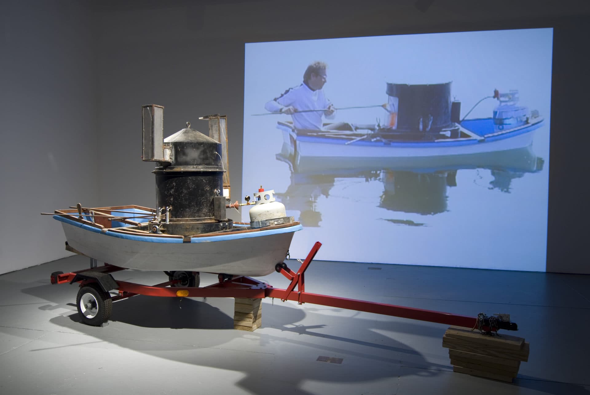 Chris Taylor's &quot;Small Craft Advisory,&quot; a glassblowing studio built into a dinghy and launched into the Atlantic Ocean, on view at Real Art Ways in Hartford, Connecticut. (Courtesy of the artist)