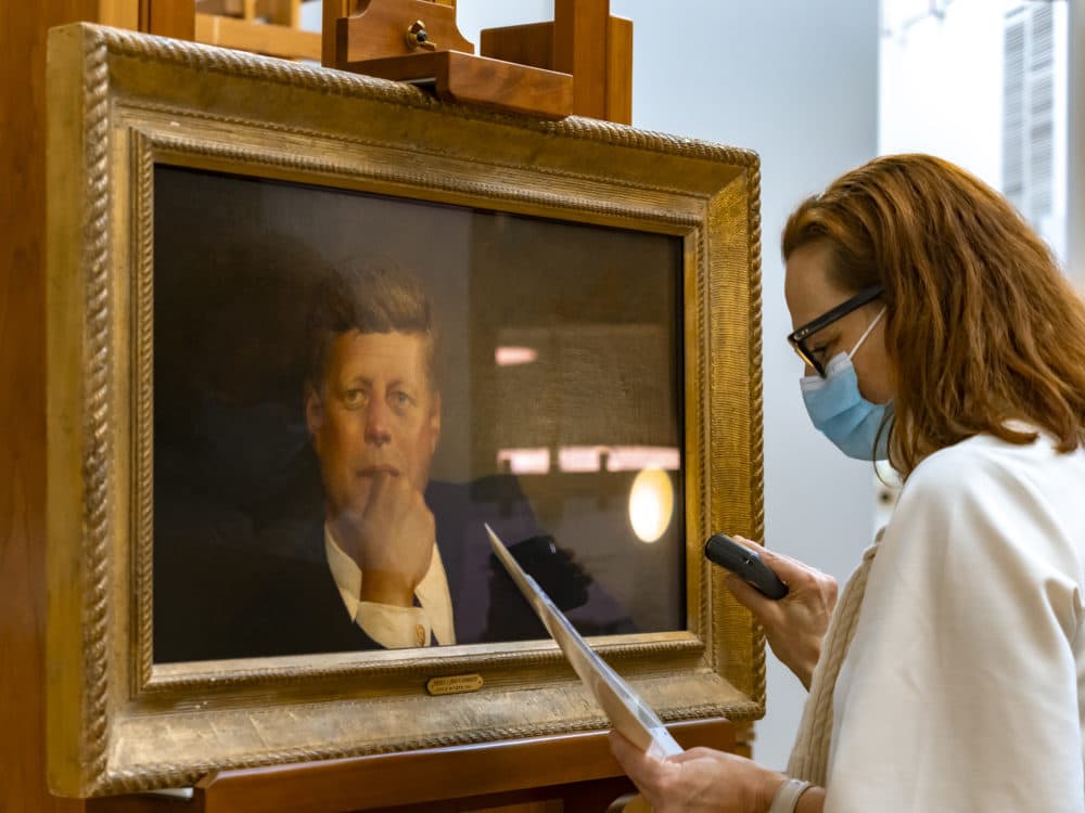 Conservator Charlotte Ameringer performs conservation work on Wyeth's Kennedy portrait at the MFA. (Courtesy Museum of Fine Arts, Boston)