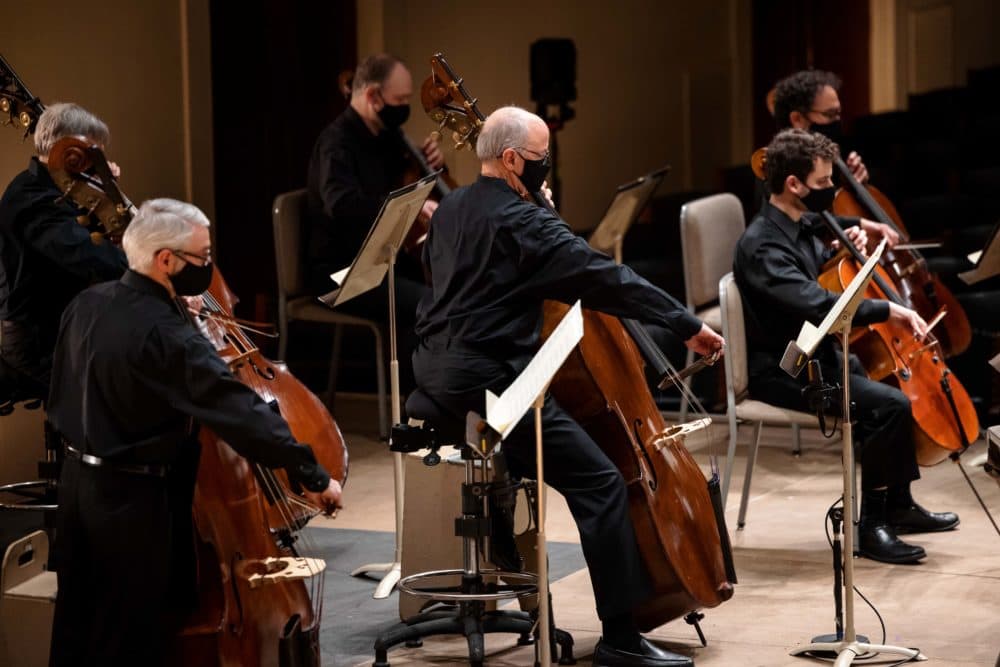 Double bass players on stage at Symphony Hall. (Courtesy BSO/Aram Boghosian)