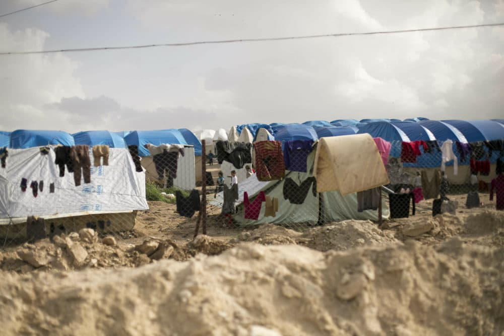 Laundry dries on a chain link fence at al-Hol camp in Syria on March 31, 2019. (Maya Alleruzzo/AP/File)