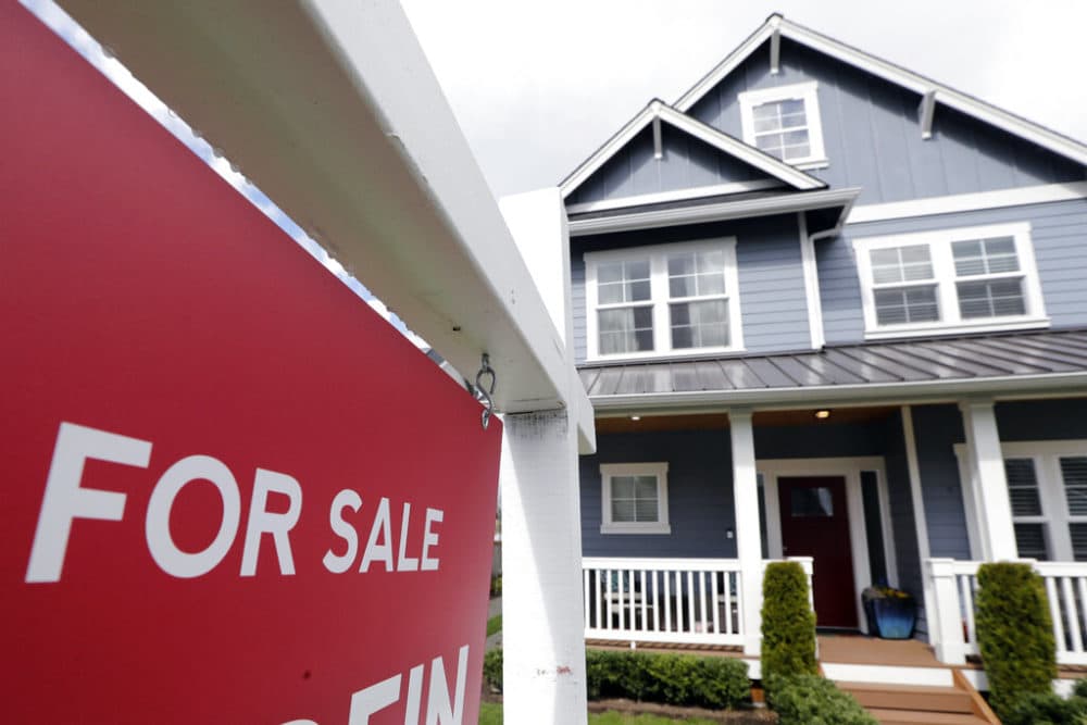 A "For Sale" sign in front of a home. (Elaine Thompson/AP)
