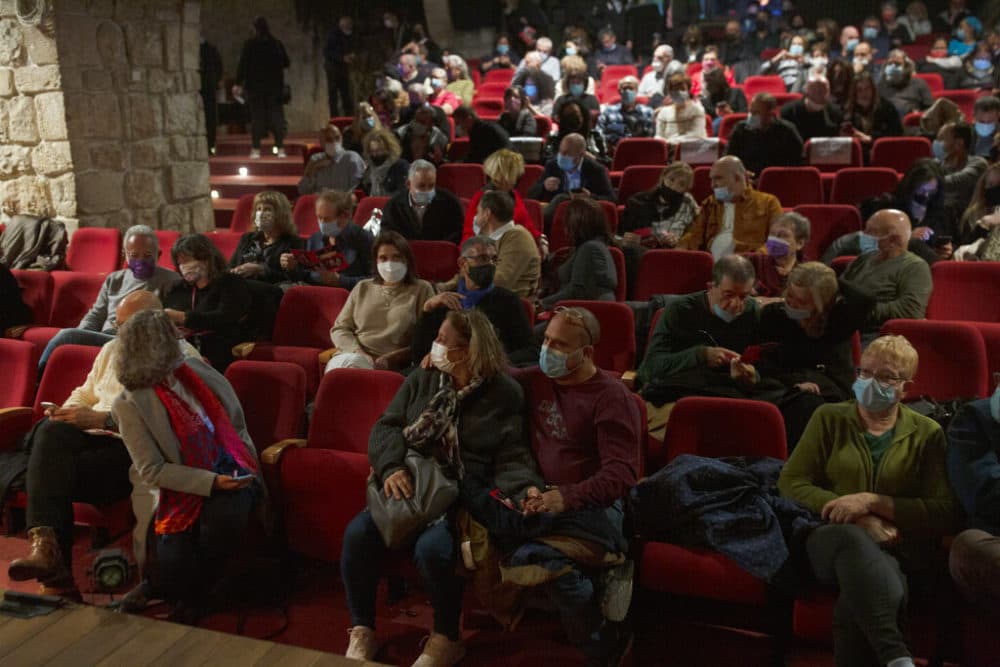 The audience waits on opening night at the Khan Theater during a performance where all guests were required to show proof of receiving a COVID-19 vaccination or full recovery from the virus, in Jerusalem, Tuesday, Feb. 23, 2021. (Maya Alleruzzo/AP Photo)