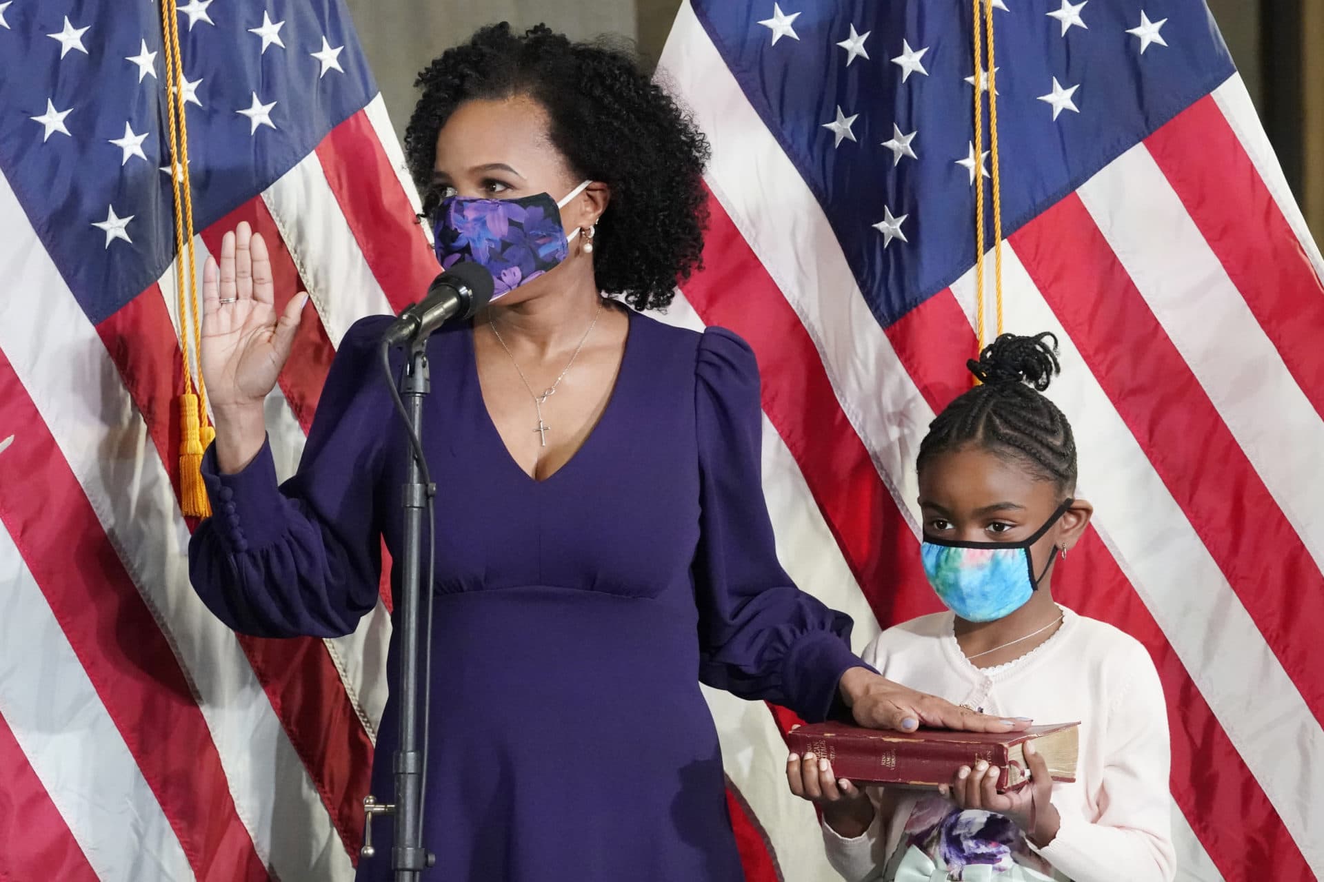 Former Boston City Council President Kim Janey, 55, is sworn in as Boston's new mayor at City Hall while her granddaughter, Rosie, holds a Bible, Wednesday, March 24, 2021, in Boston.(Elise Amendola/AP)