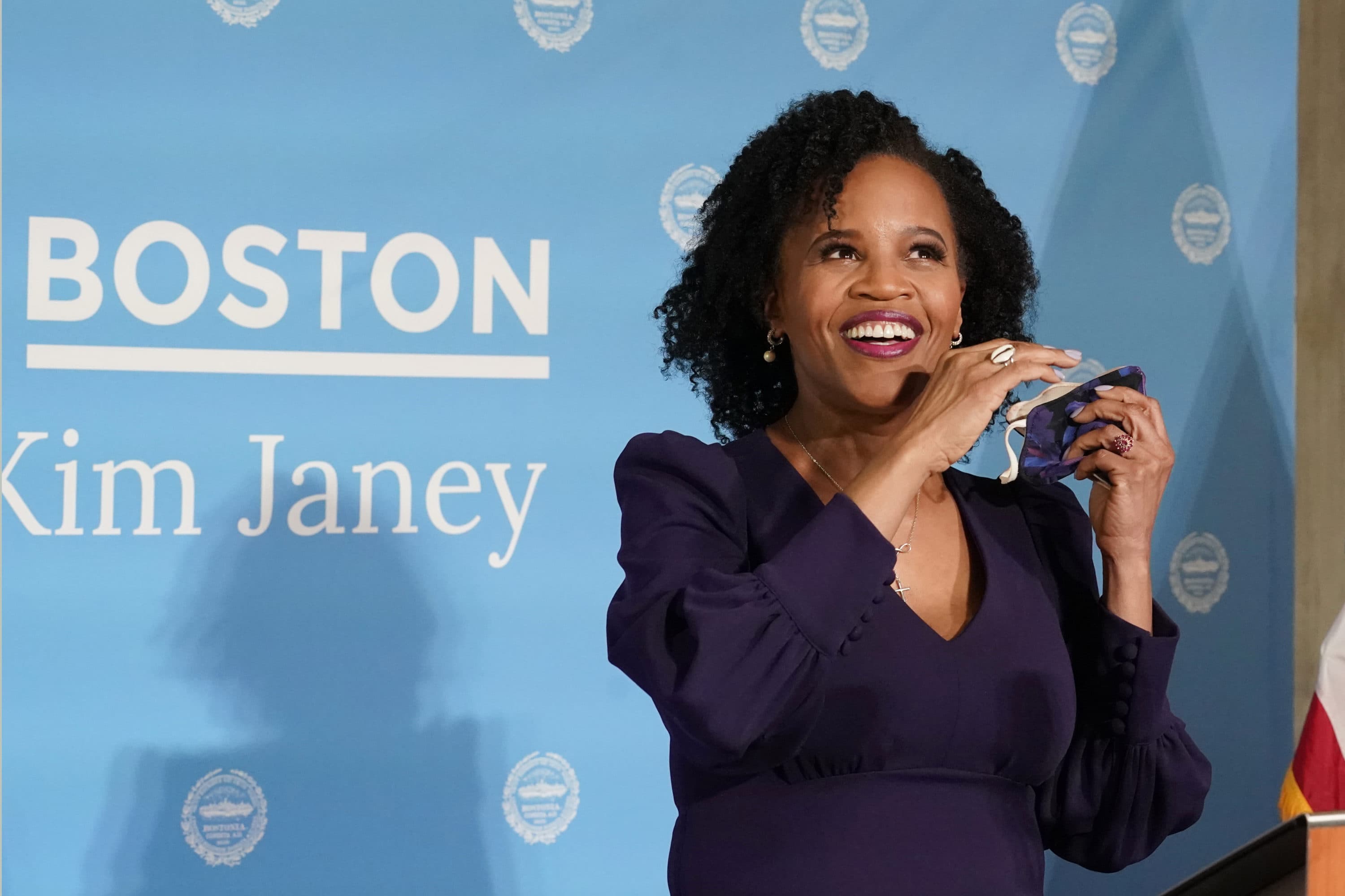Former Boston City Council President Kim Janey, 55, takes off her face mask to speak after she was sworn in as Boston's new mayor at City Hall, Wednesday, March 24, 2021, in Boston. Janey, who is the city's first female and first person of color to take the office, replaces Marty Walsh who resigned Monday evening to become President Joe Biden's labor secretary. (AP Photo/Elise Amendola)