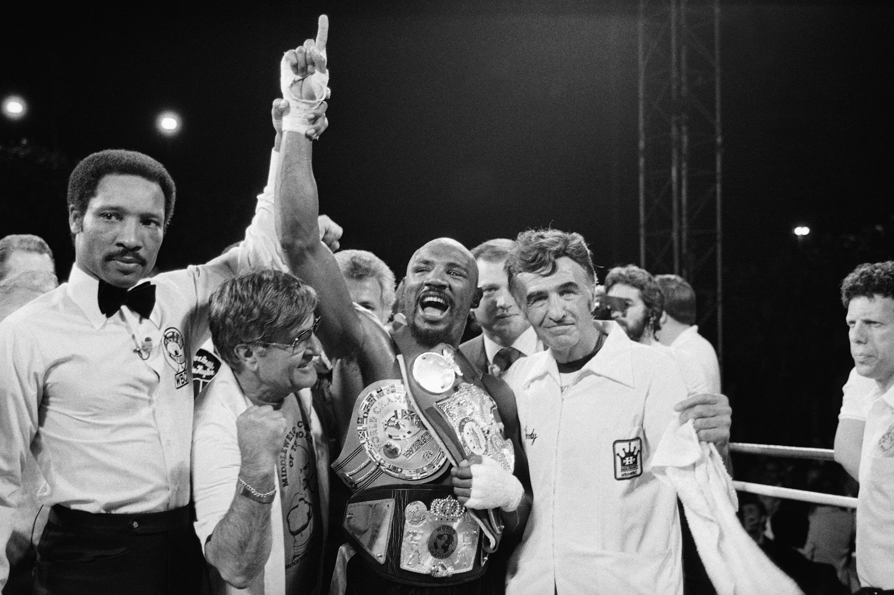 Middleweight Champion Marvelous Marvin Hagler celebrates his undisputed world middleweight Championship with his manager, Pat Petronelli, and Co-Manager, Goody Petronelli on Monday, April 15, 1985 in Las Vegas. Hagler knocked out Thomas "Hitman" Hearns in the third round to clinch the title. (AP Photo)