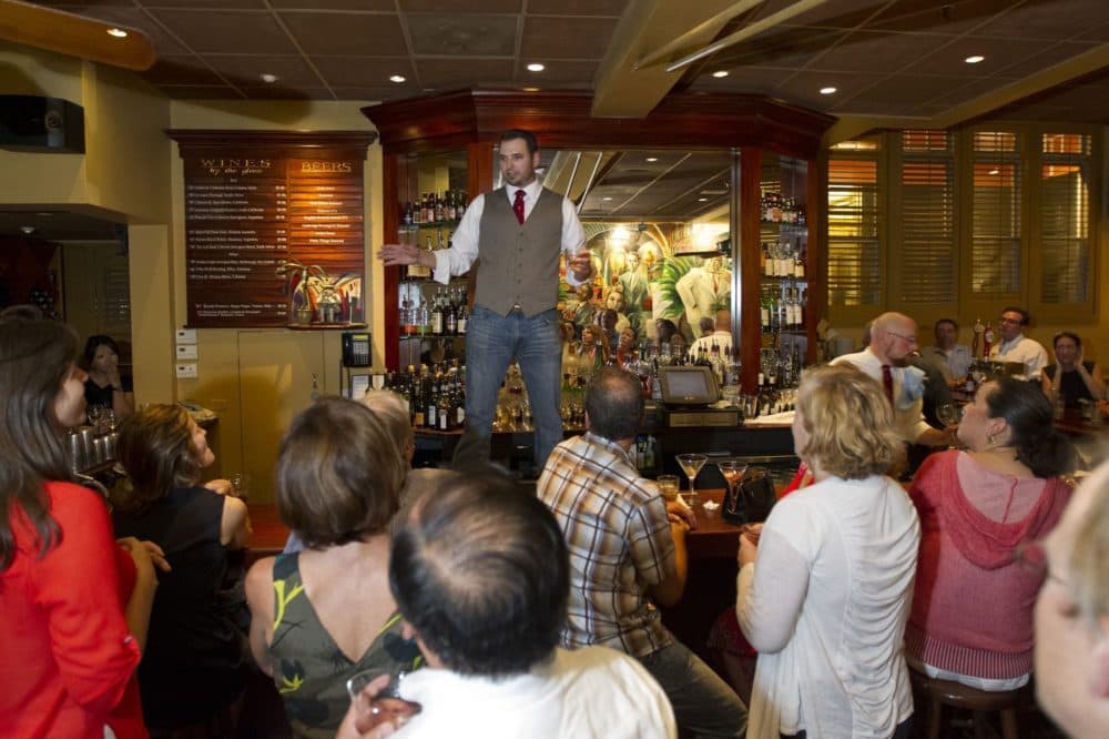 Jason Abul-Jubein, son of Casablanca owner, Sari, making a farewell toast at the restaurant in 2012. (Courtesy Boston Globe/Matthew J. Lee) 