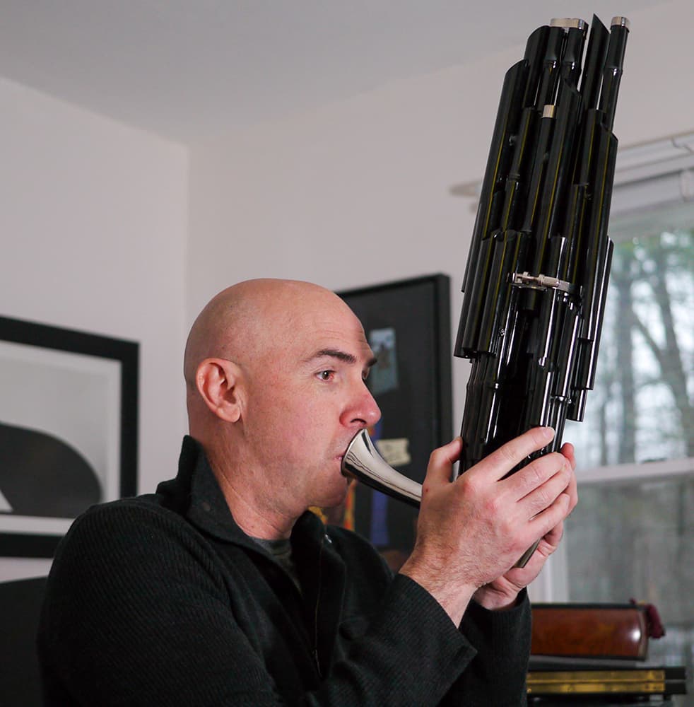 Eric Shimelonis playing the sheng, a.k.a the “mouth organ.” (Photo courtesy of Rebecca Sheir)