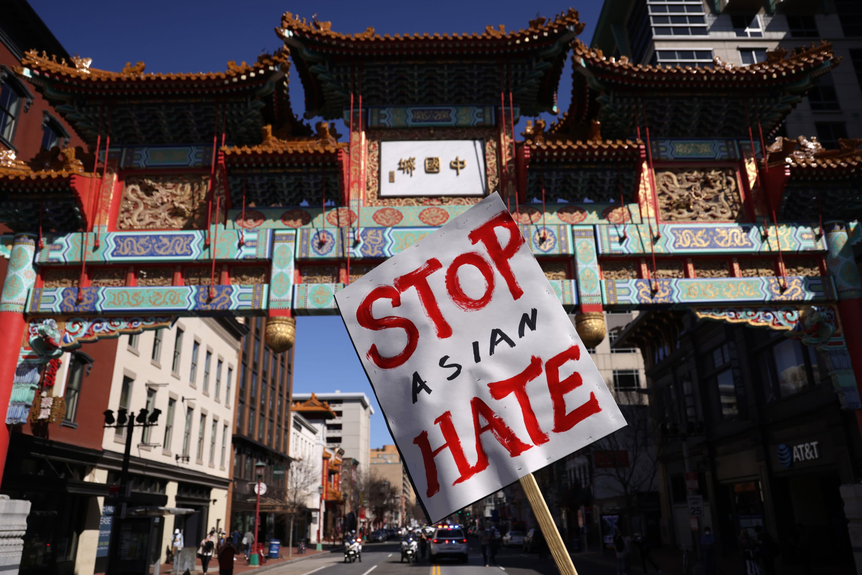An activist holds a sign during a rally in response to the Atlanta, Georgia spa shootings that left eight people dead, including six Asian women. (Alex Wong/Getty Images)