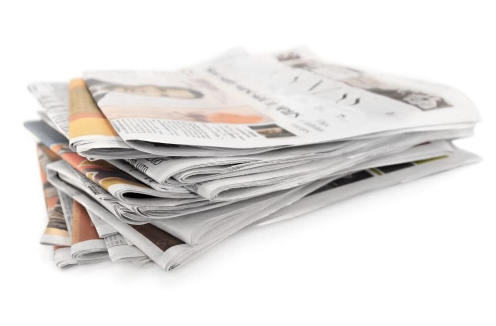 A pile of newspapers. (Getty Images)