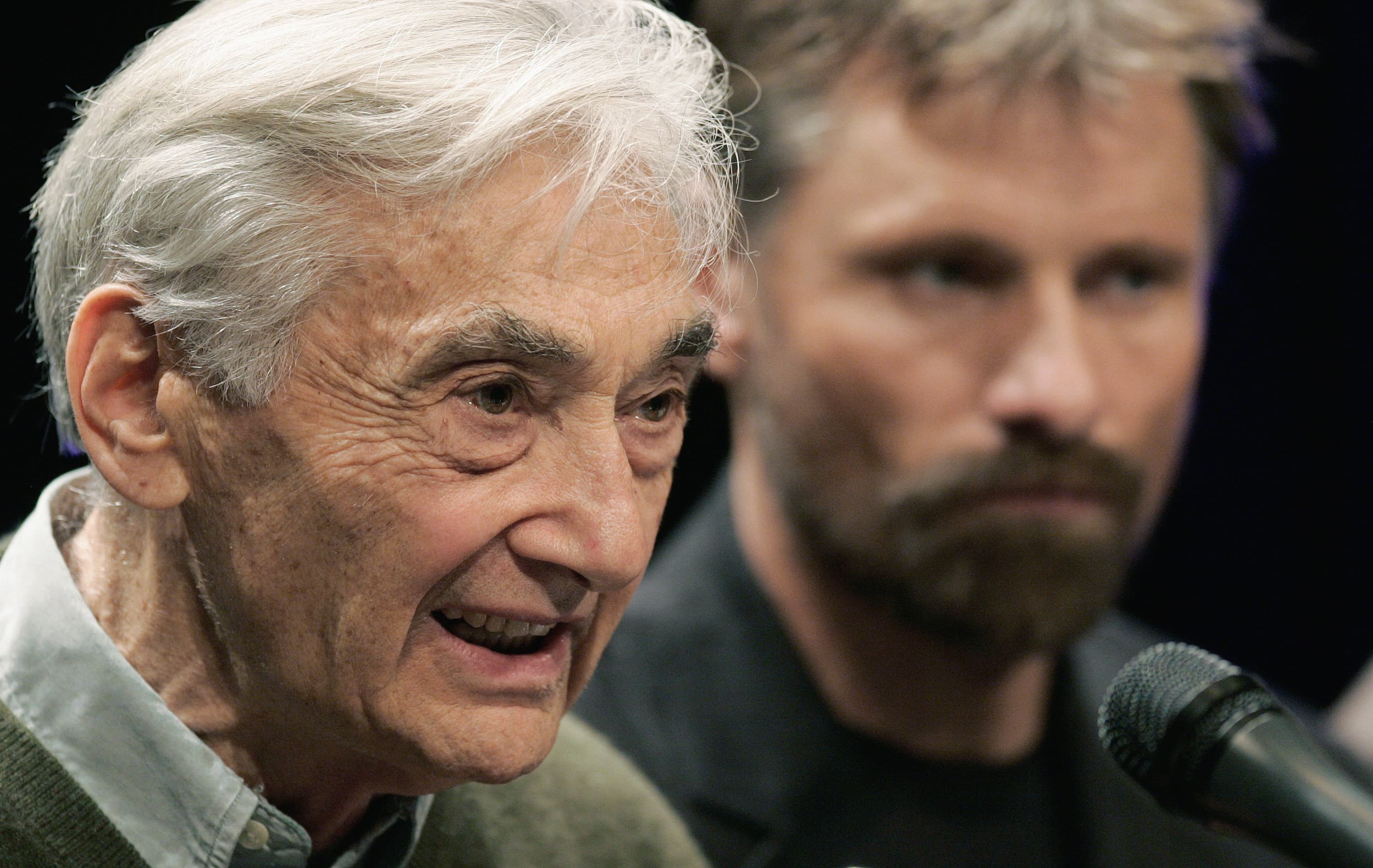 Howard Zinn and actor Viggo Mortensen take part in a 2008 panel discussion about &quot;The People Speak&quot; at Emerson College in Boston. (Michael Dwyer/AP)