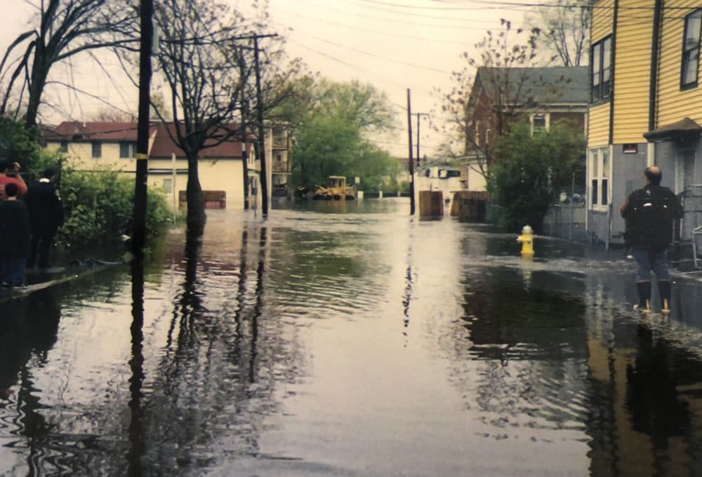Water fills the street in front of Tennis Lilly's home in Lawrence during the 2006 Mother's Day floods (Courtesy Tennis Lilly)