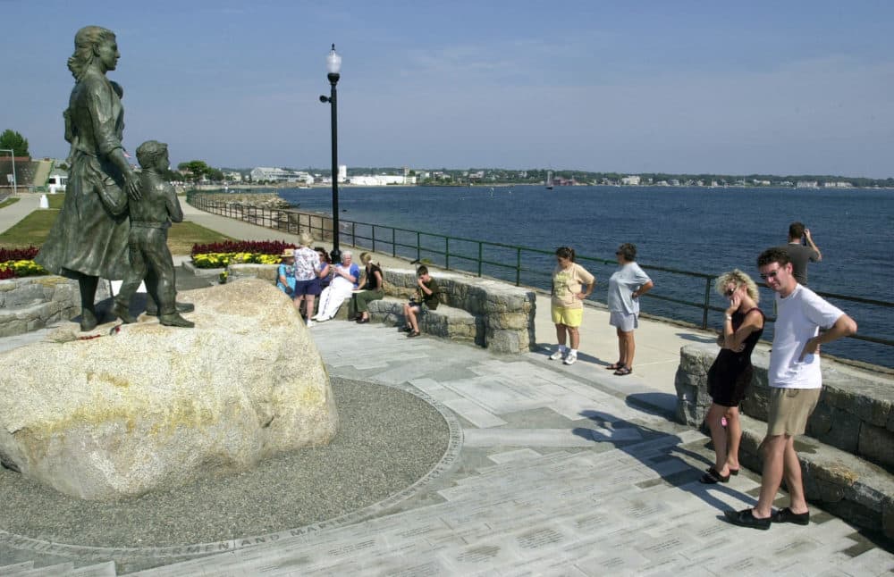 People look over the names of sailors lost at sea at the Fishermen's Wives Memorial in Gloucester, Mass, the author's hometown. August 7, 2001. (Photo by Gregory Rec/Portland Press Herald via Getty Images)