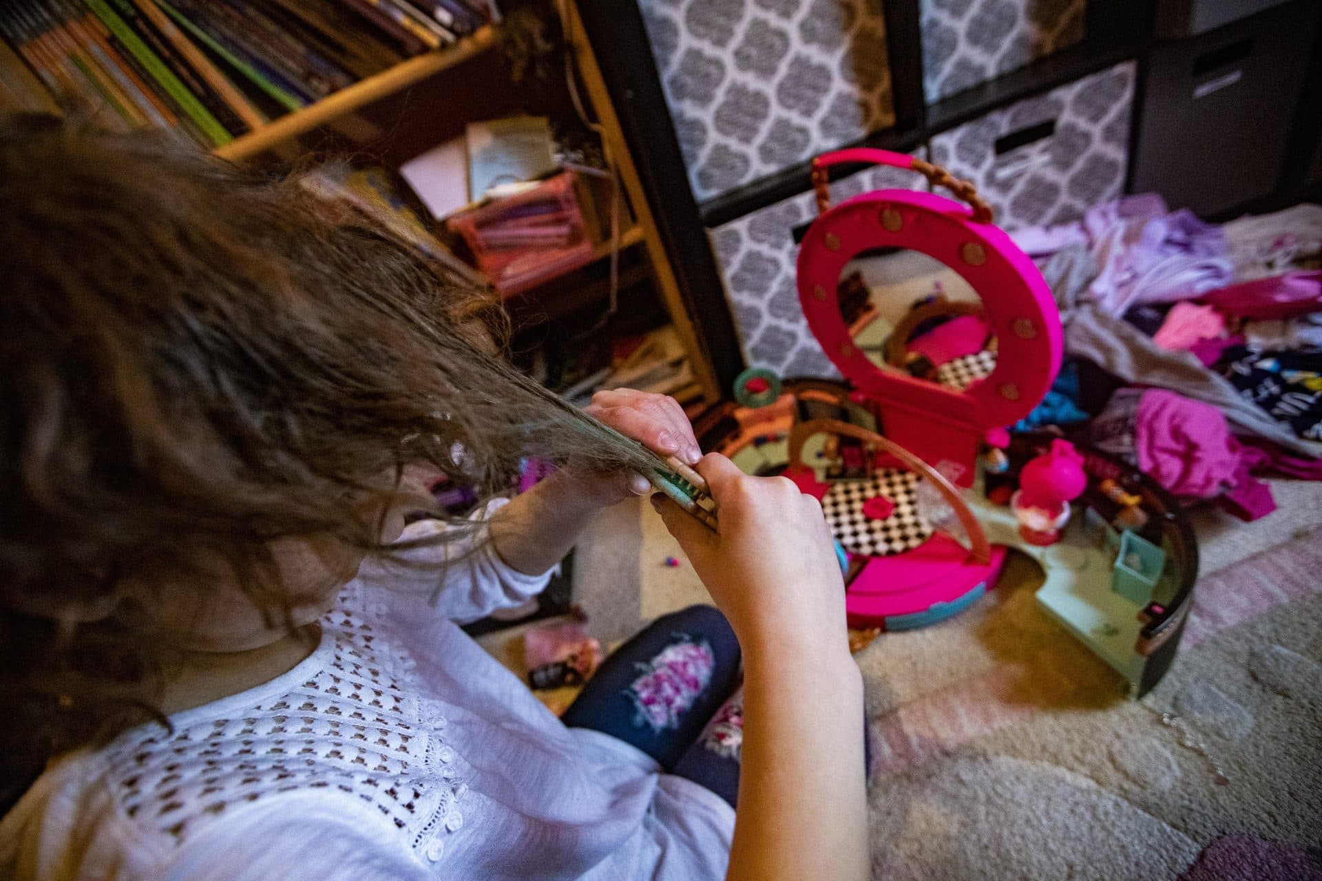 Hallel uses green hair chalk from their sister’s salon kit. (Jesse Costa/WBUR)