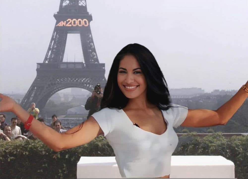 Selena photoshopped in front of the Eiffel Tower.
