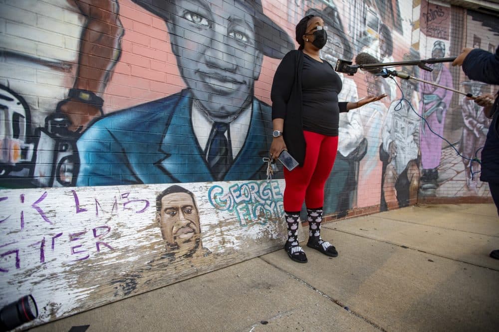 Activist Monica Cannon-Grant talks to reporters in front in Nubian Square. (Jesse Costa/WBUR)