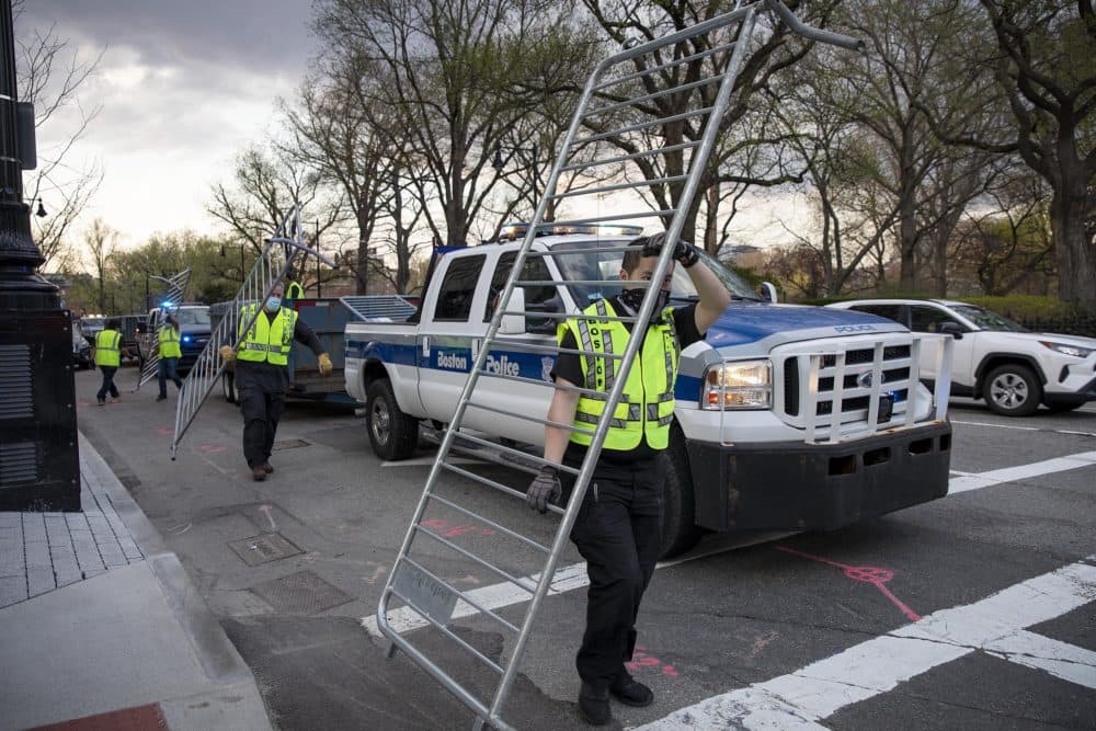 Following the verdict in the trial of Derek Chauvin, police set crowd barriers in place on Arlington Street in Boston Tuesday. (Robin Lubbock/WBUR)