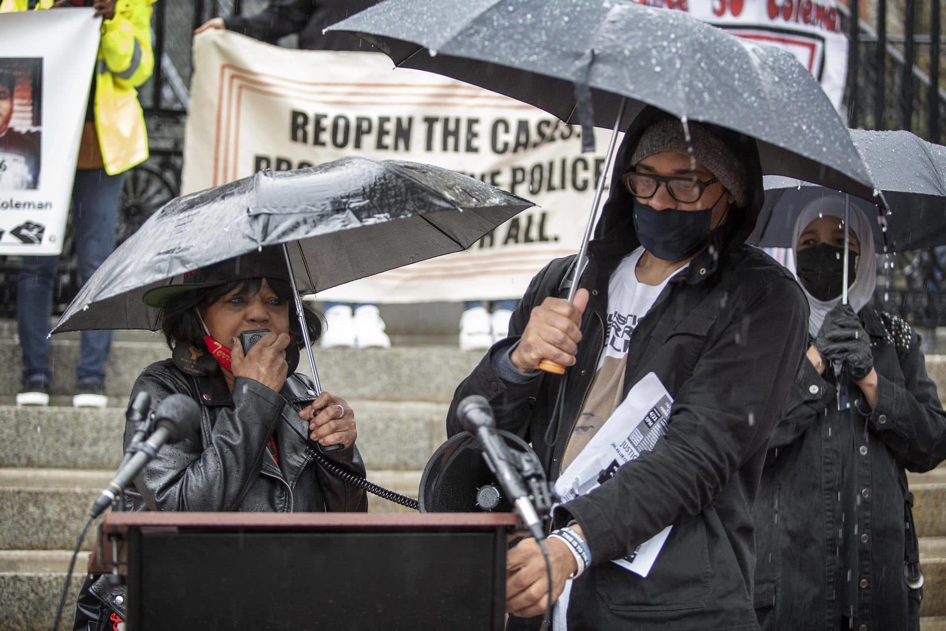 Hope Coleman, mother of Terrence Coleman who was killed by police in 2016, speaks to the crowd gathered in the rain outside the Massachusetts State House. (Robin Lubbock/WBUR)