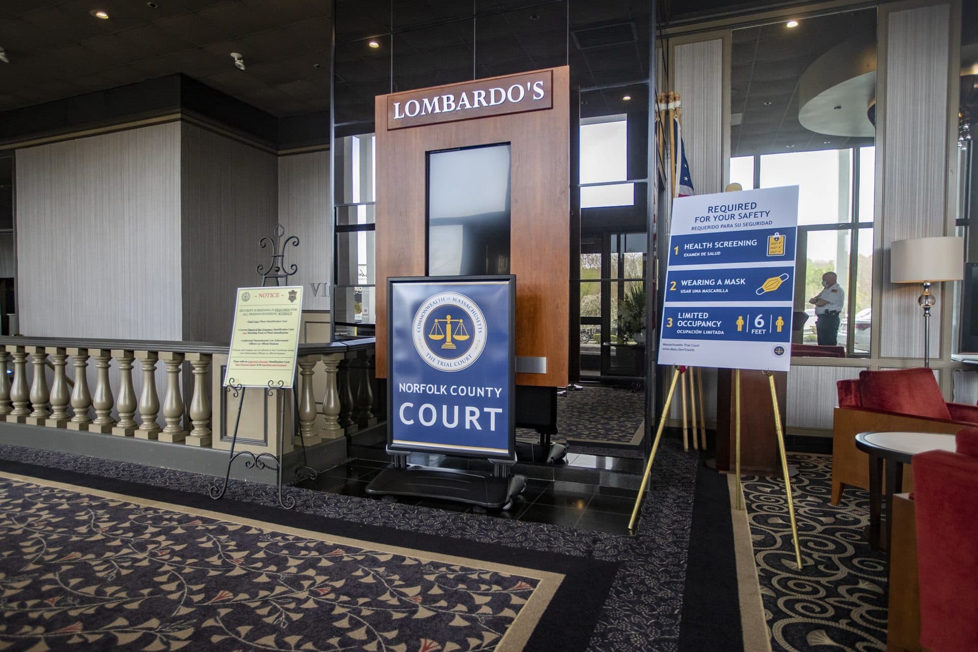 Signs for the Norfolk County Court in the entrance of Lombardo’s in Randolph. (Jesse Costa/WBUR)