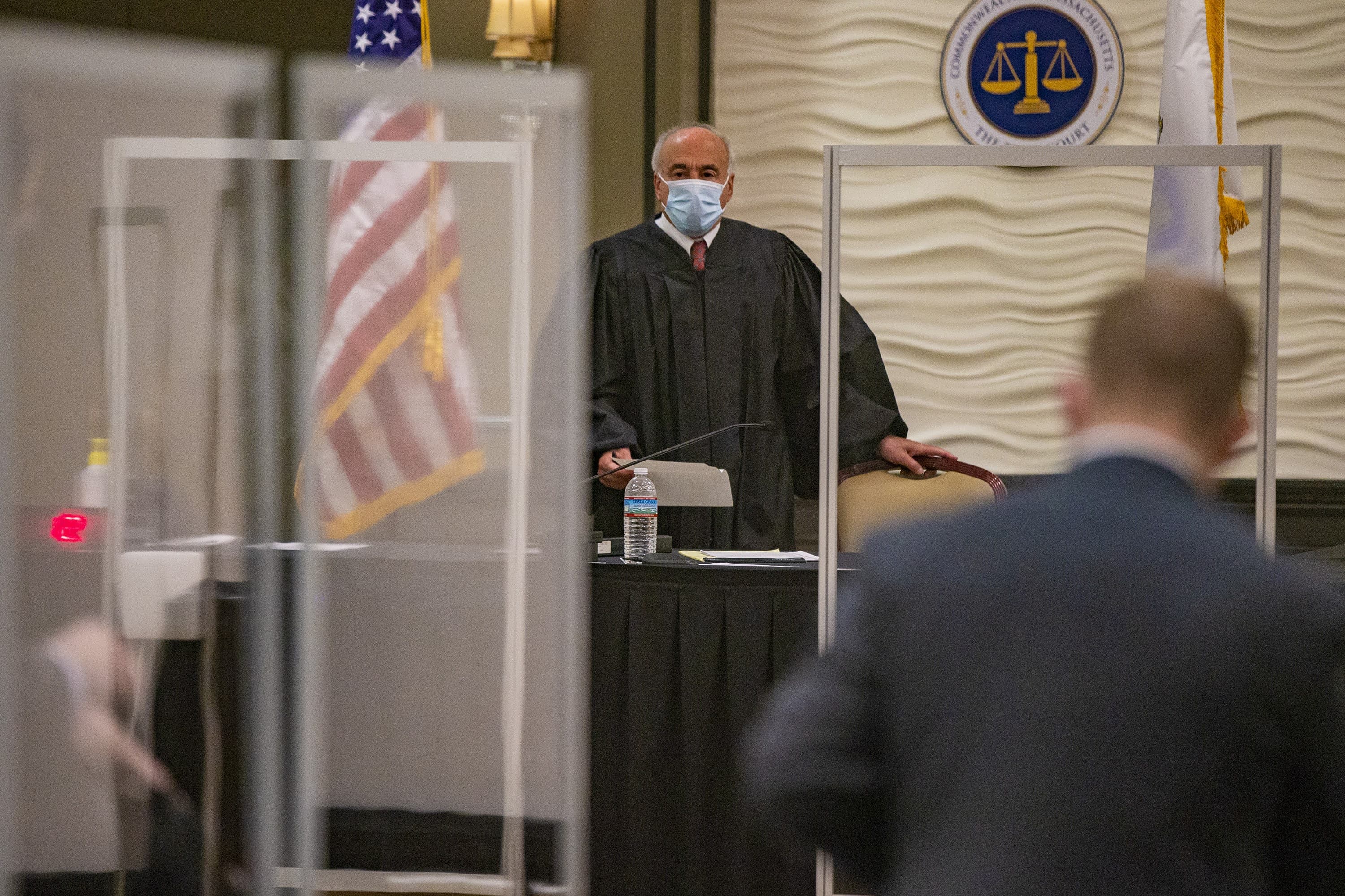 Quincy District Court Judge Mark Coven enters the courtroom he will preside over at Lombardo’s function hall in Randolph. (Jesse Costa/WBUR)