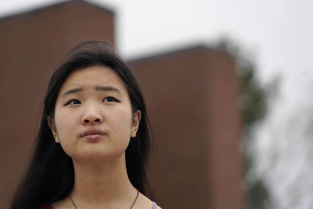 High school student Grace Hu, 16, of Sharon, Mass., stands for a photograph near Sharon High School, April 11, 2021, in Sharon. Hu, who plans to to go back to in-person classes in April, helped organize a rally in Boston in early April against anti-Asian hate, but said she's not concerned about facing vitriol when her school reopens fully. (Steven Senne/AP)